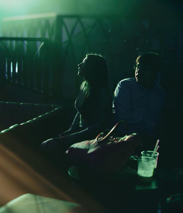 Person in motion during a light cardio exercise in a bright room.